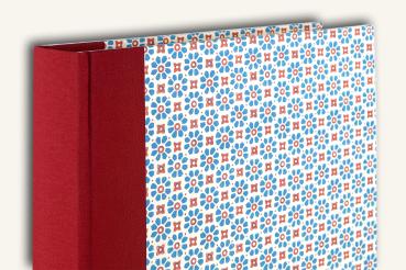 Photo album, red linen spine, geometrically patterned cover, stylized flowers, blue, red pril flowers